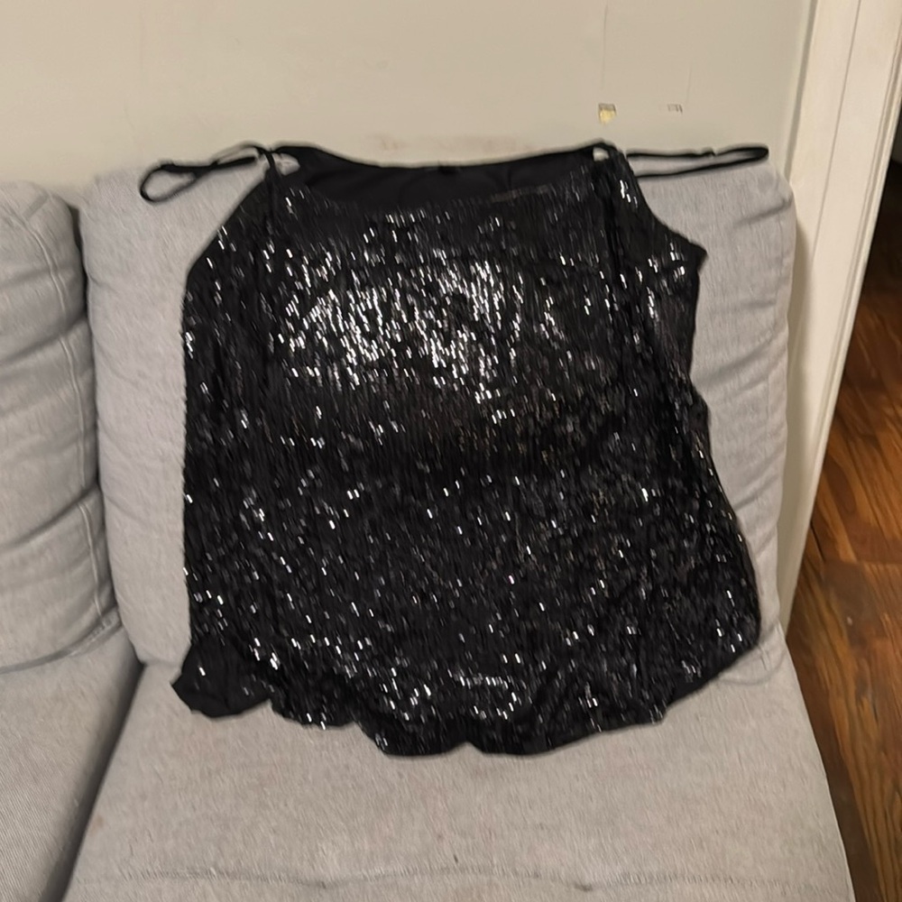 This I an amazing black sequin top in a size Large from j crew